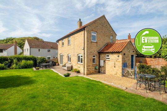 4 Sanctuary Cottage, three bedroom cottage in Thorpeness - brick house exterior with lawn, patio and garden furniture