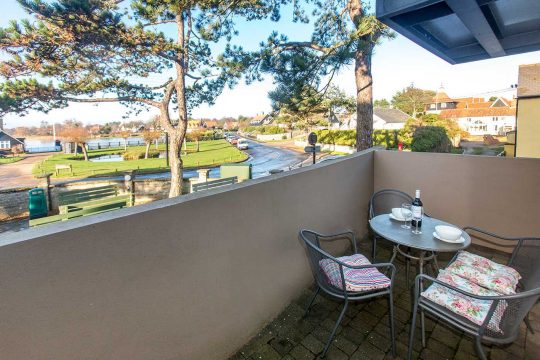Boat Lake, studio in Thorpeness - private terrace with bistro table and chairs overlooking the Meare