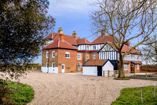 The Dower Retreat, cottage retreat in Thorpeness - red brick and timber-framed house with gravel drive
