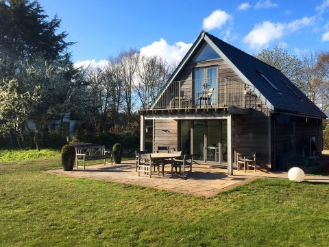 White Cottage, countryside apartment at Iken near Snape - timber-clad house with balcony, patio and lawn