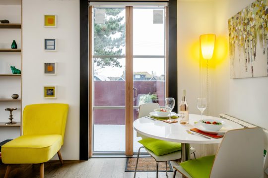 Regatta studio apartment, Thorpeness - dining table for two by the patio doors