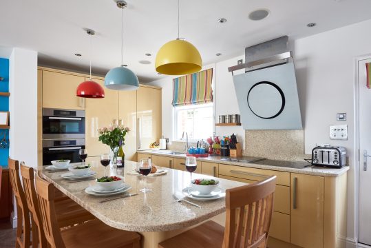 252 Aldeburgh Townhouse, Aldeburgh - kitchen with breakfast bar and red, blue and yellow pendant lights