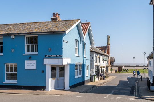 Seagulls, Aldeburgh - blue-painted corner house on Wentworth Road with the seafront beyond